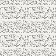 Seamless pattern of abstract strokes and dots.