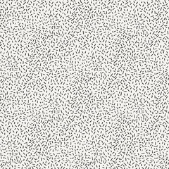 Seamless pattern of abstract strokes and dots.