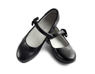 Pair of black shoes for girl on white background
