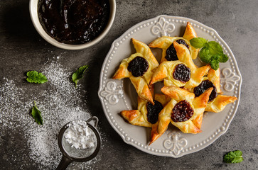 Homemade Danish pastry with vanilla pudding and plum jam