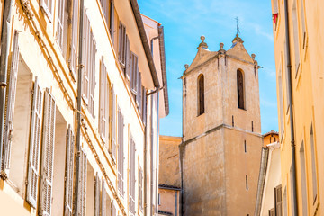 Church tower on the narrow street in the old town in Aix-en-Provence in France