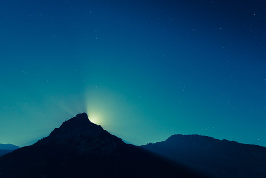 magnificent night sky and stars. Moon over mountain top.
