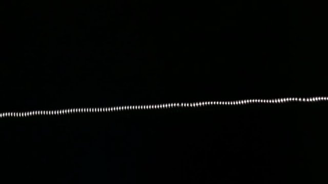 Installing a new microcoil using coil jig on clearomizer closeup