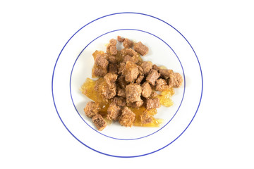 wet food for cats or dogson a plate isolated on white, view from above