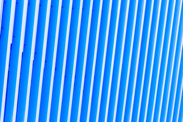 Detail of blue striped metal facade for background