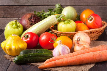 harvest of vegetables on a wooden background