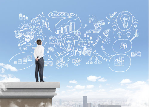 Businessman in white shirt on rooftop