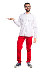 Handsome man with glasses holding something