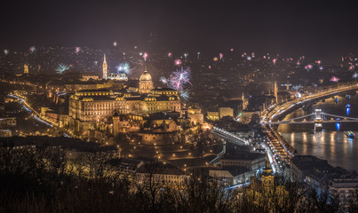 New Year Celebration. Buda Castle or Royal Palace in Budapest, Hungary with Fireworks at Night as Seen from Gellert Hill