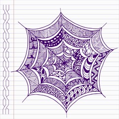 Hand drawn spider's web in doodle style on notebook page.