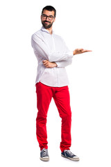 Handsome man with glasses presenting something