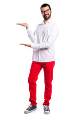 Handsome man with glasses presenting something