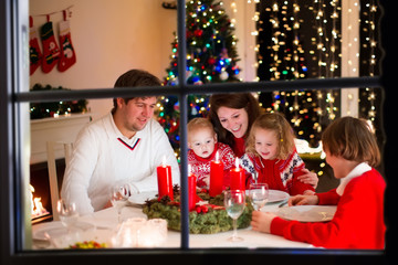 Family at Christmas dinner at home