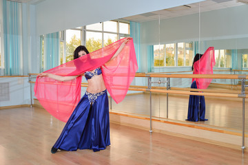 Beautiful woman dancing in arabic costume, oriental or belly dance