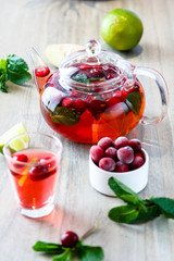 Tea in a glass teapot from the strawberries and raspberries