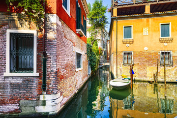 Venice cityscape, water canal, bridge and traditional buildings.