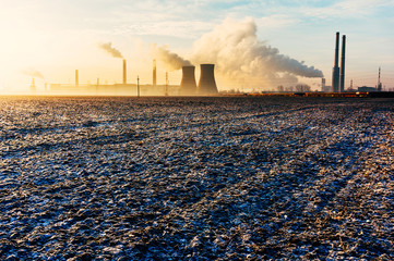 Oil refinery over frozen ground