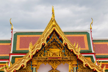 Fototapeta premium Thai art on roof Church at phathat Cheung choom woravihan temple