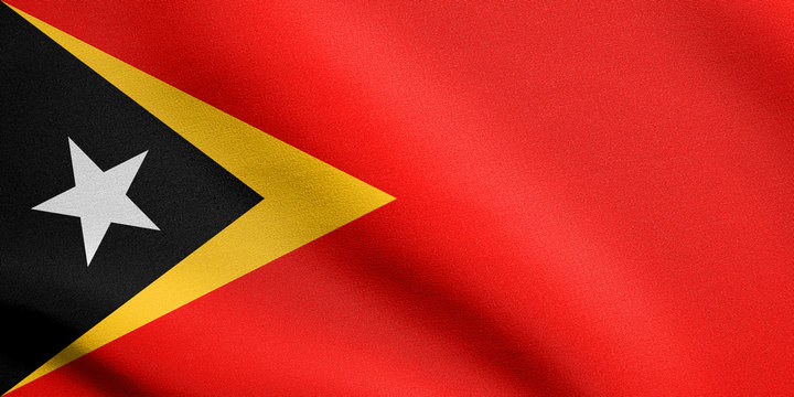 Flag of East Timor waving with fabric texture
