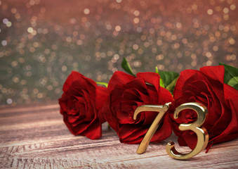 birthday concept with red roses on wooden desk. seventy-third. 73rd. 3D render