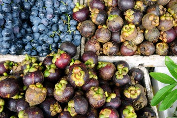 Purple mangosteen fruit at an Asian market