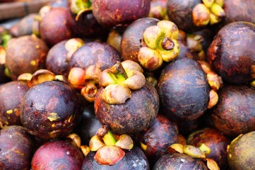 Purple mangosteen fruit at an Asian market