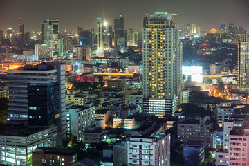 Fototapeta na wymiar Asian downtown night scene, beautiful modern buildings, bright g