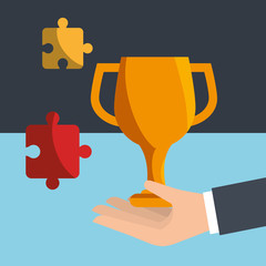 hand holding a gold trophy cup and jigsaw puzzles over blue background. vector illustration