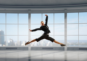 Dancing businesswoman in office . Mixed media