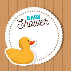 baby shower card with yellow duck toy cartoon over wooden background. colorful design.vector illustration
