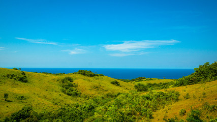 Fototapeta premium Green, Rolling Island Hills - With Blue Ocean View - Catanduanes, Philippines