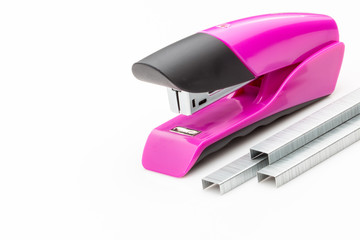 Pink Stapler and staples on a white background. - 122705889