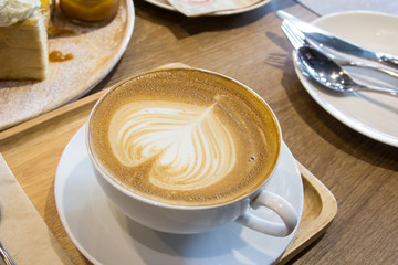 cup of coffee with heart pattern