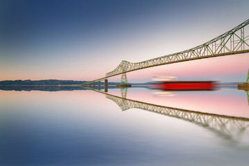 Fine art bridge and ship in clear sky with reflections