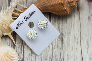 earrings on wooden background