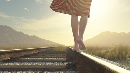 A walking barefoot girl on the railway