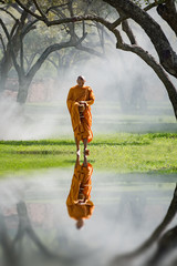 Buddhist monk walk receive food in the morning, among cold weather and fog, Vintage
