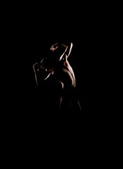 Silhouette trace of a male ballet dancer on black