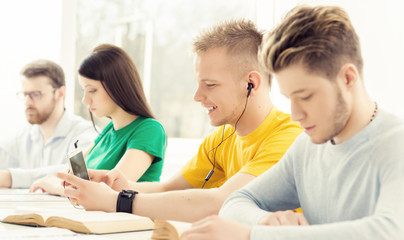 Young and smart students learning in a classroom