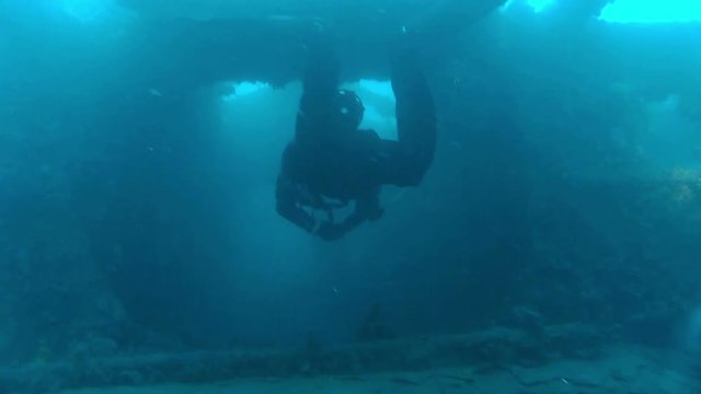 Scuba Diver Exploring Inside Shipwreck