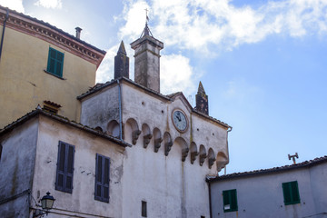 Fototapeta na wymiar building with clock and bell tower, italy