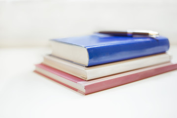 Naklejka premium Pile of books on the table 