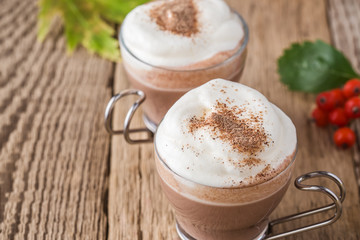 Homemade cinnamon and spice hot cocoa with whipped cream