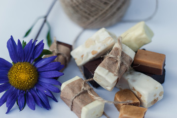Italian nougat bars cut in pieces on white background