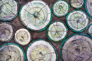 Background: A molding on a wall in the form of a warehouse of firewood