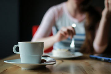 girl in a cafe for a cup of coffee with the notebook