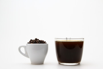Obraz na płótnie Canvas cup of whole bean coffee and hot coffee
