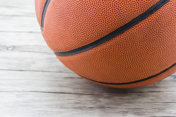 Fototapeta premium Basketball ball on wood background