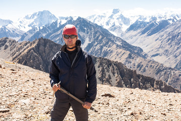 Hiker relaxing on top of a mountain