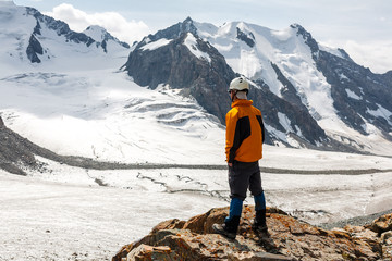 Hiker relaxing on top of a mountain